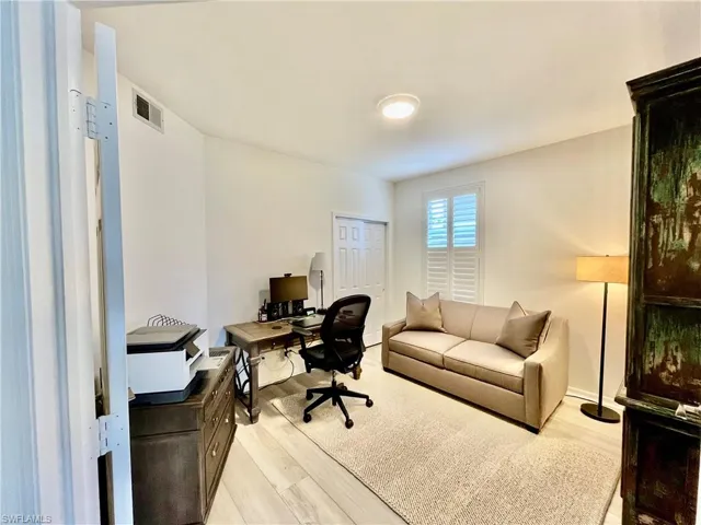 Office area featuring light wood-style flooring