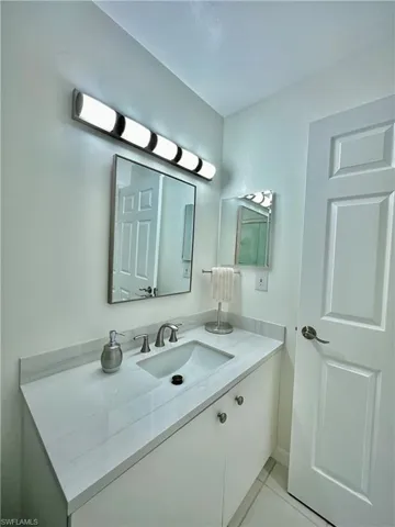 Bathroom with vanity and tile patterned floors
