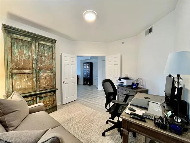 Home office with light wood-style floors