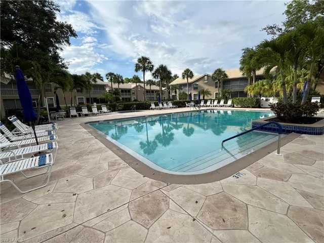 Community pool featuring a patio