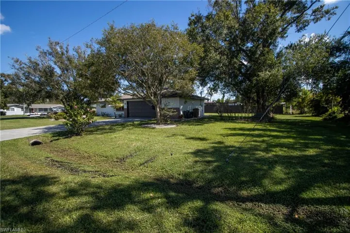 View of yard featuring a garage