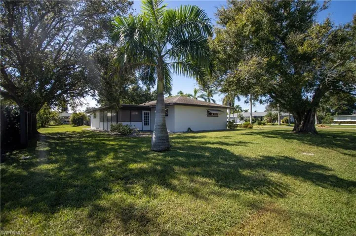 View of yard with a sunroom