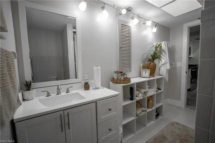 Bathroom featuring tile patterned floors, vanity, and toilet