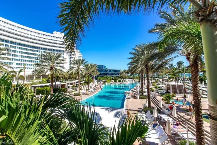 Community pool with a patio area