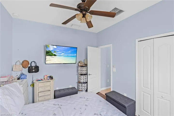 Bedroom with a closet and a ceiling fan