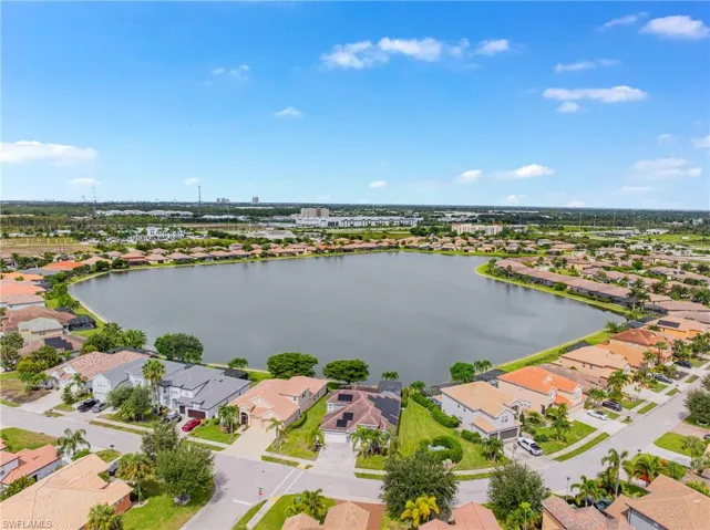 Aerial view of residential area with a large body of water
