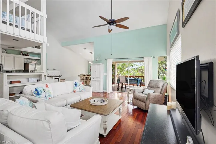 BLUE BAYOU B:  MAIN LIVING AREA WITH LOFTED CEILING.  SLIDING DOORS TO OUTDOOR COVERED BALCONY.  LOFT AREA SHOWN AT UPPER LEFT.