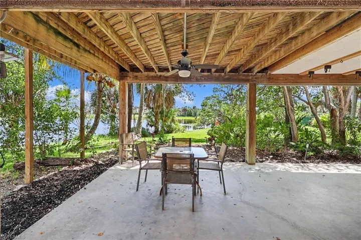 BLUE BAYOU A:  COVERED OUTDOOR LIVING AREA WITH OUTDOOR FURNITURE AND GRILL.  (OUTDOOR SOFA IS TO RIGHT.)