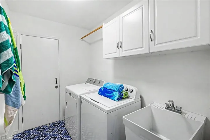 BLUE BAYOU A:  LAUNDRY ROOM W/CONVENIENT UTILITY TUB AND STORAGE