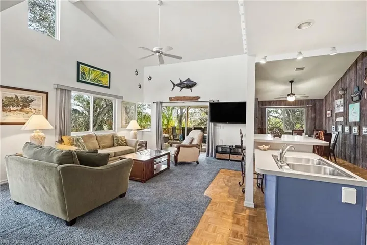 BLUE BAYOU A:  MAIN LIVING AREA.  ENTRANCE TO COVERED DECK IS AT MIDDLE REAR.  DINING AREA IS AT RIGHT REAR.