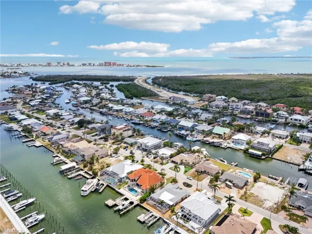 Aerial perspective of suburban area with a nearby body of water