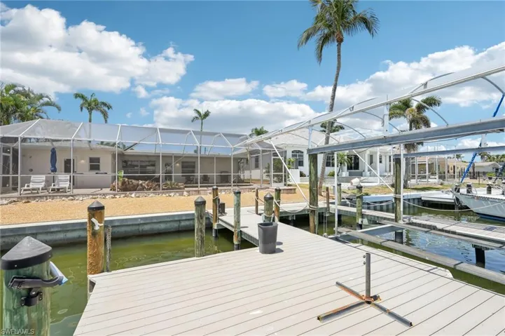Dock with a water view and boat lift