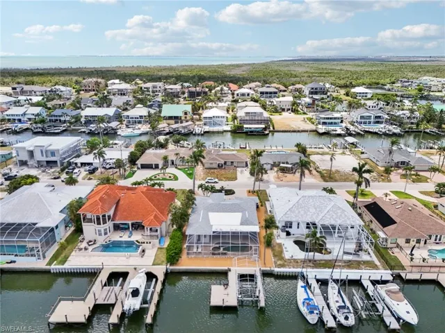 Aerial perspective of suburban area with a large body of water