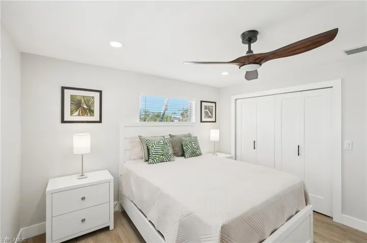 Bedroom featuring light wood-style flooring, a closet, recessed lighting, ceiling fan, and baseboards