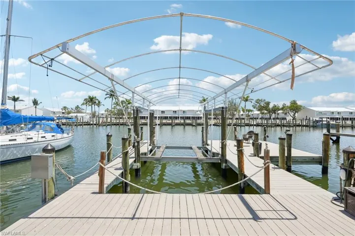 Dock featuring a water view and boat lift