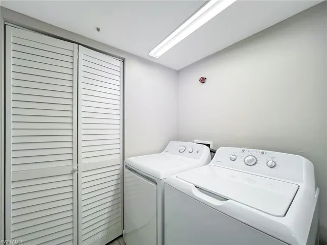 Separate laundry room with storage closet