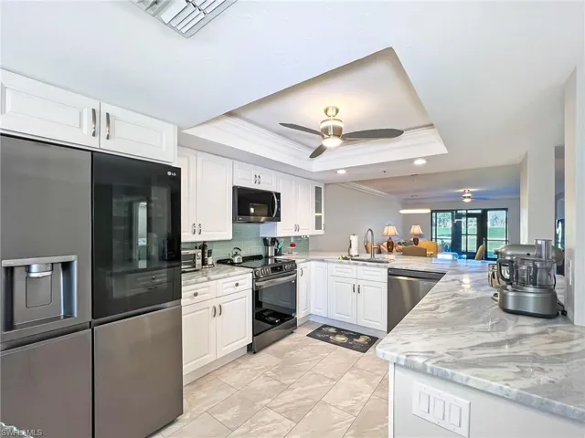 Upgraded appliances and cabinetry, and granite countertops