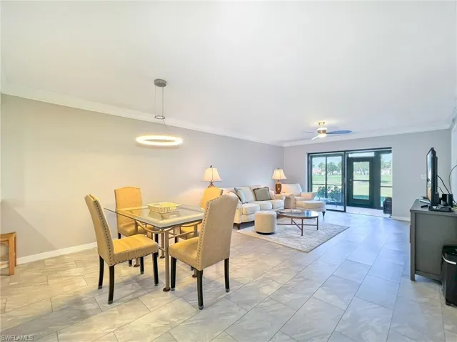 Spacious living area looking out onto rear lanai with beautiful golf course views.