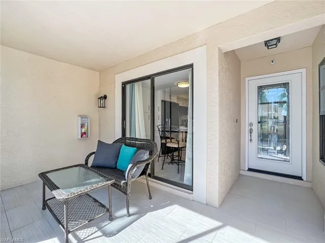 Front entry.  Notice new glass door.  Sliders open into kitchen.