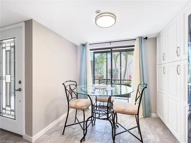 Eat in kitchen area overlooking front lanai.  Notice glass entry door and pantry.