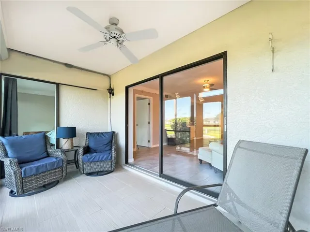 Rear lanai with electric hurricane shutters and sliders opening into Master Bedroom and Living Room