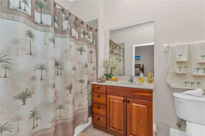 Full bathroom with a shower with shower curtain and vanity