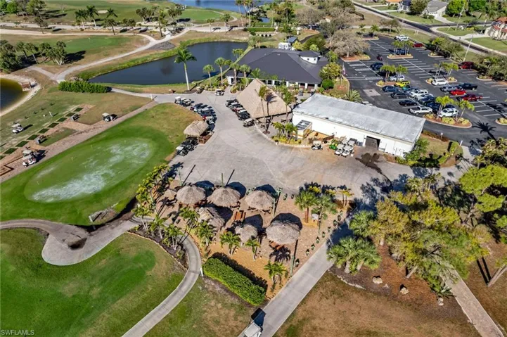 View of property location featuring a local golf course and a nearby body of water