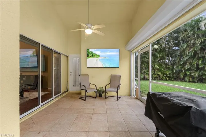 Newly screened Patio with ceiling fan and vaulted ceiling