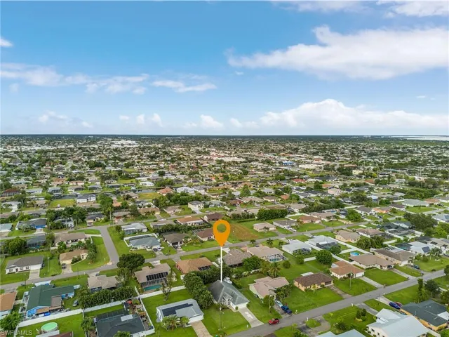 Aerial overview of property's location with nearby suburban area
