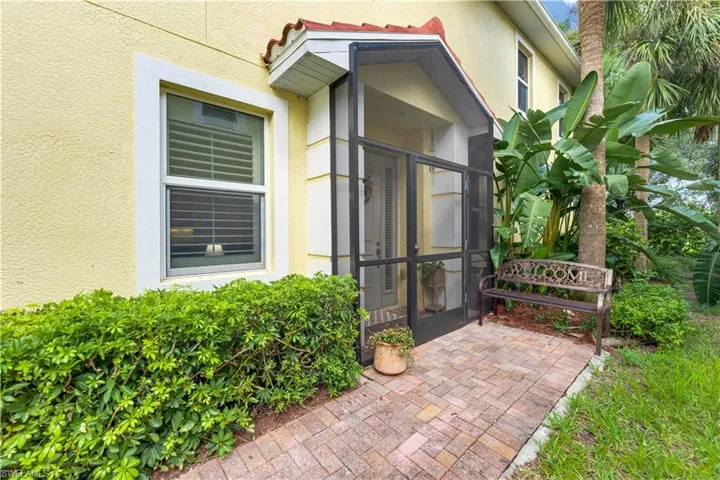 Doorway to property featuring a patio