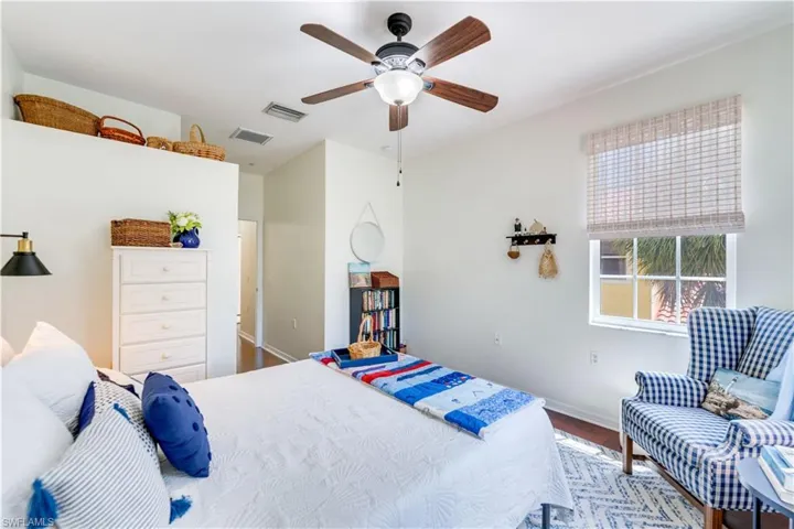 Bedroom featuring ceiling fan and hardwood / wood-style floors