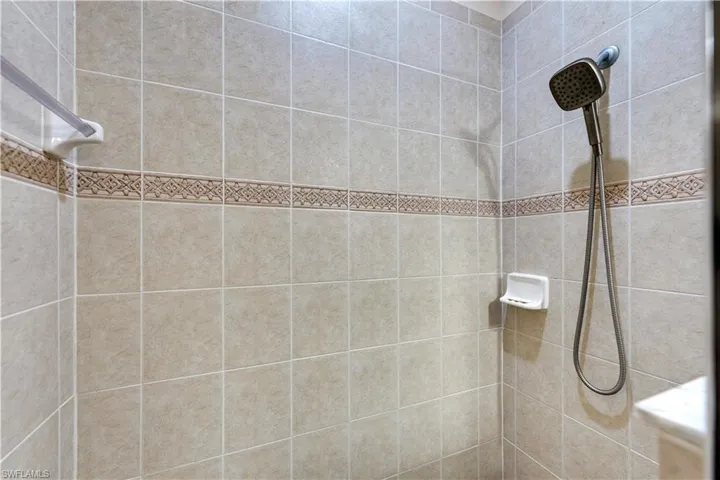 Bathroom featuring tiled shower