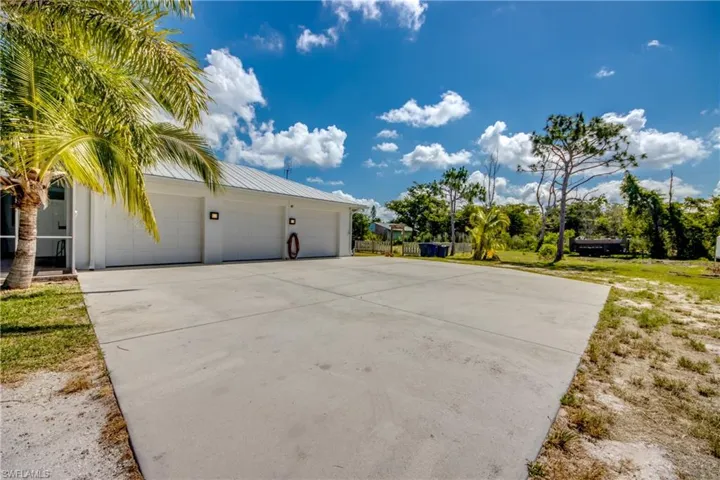 View of property exterior featuring a garage