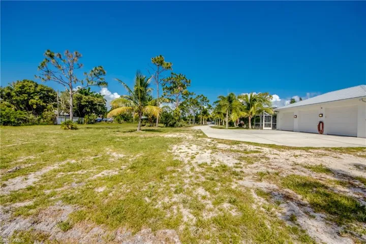 View of yard with a garage