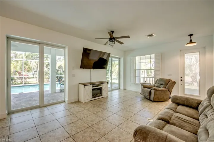 Tiled living room is light and airy letting in natural sunlight