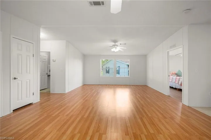 Unfurnished living room with light wood-type flooring
