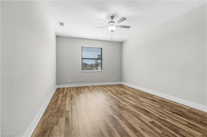 Carpeted spare room with baseboards