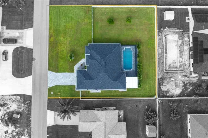 Aerial view of property's location featuring property boundaries highlighted and a pool area