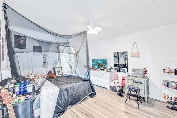Bedroom featuring wood finished floors and ceiling fan
