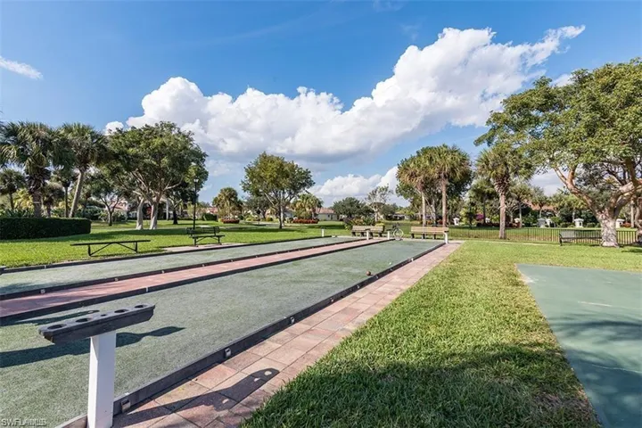 View of property's community featuring a yard