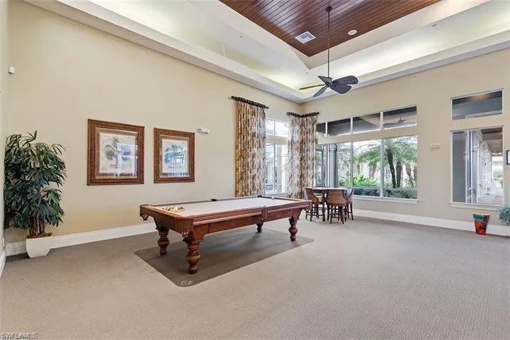 Playroom with pool table, carpet floors, a high ceiling, ceiling fan, and wooden ceiling