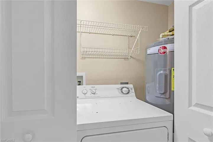 Clothes washing area with washer / dryer and water heater