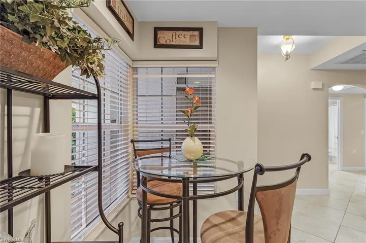 Dining space featuring light tile patterned floors