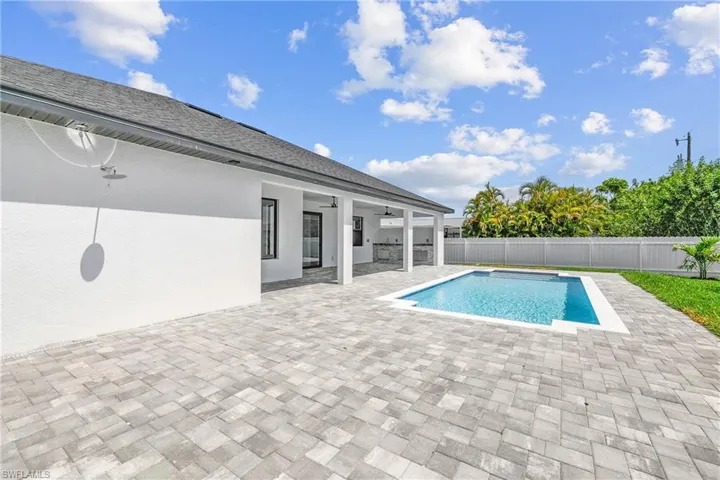 View of pool featuring a patio and ceiling fan