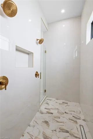 Bathroom with a tile shower