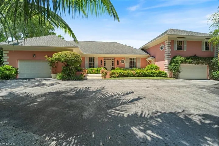 View of front of house with ample guest parking.