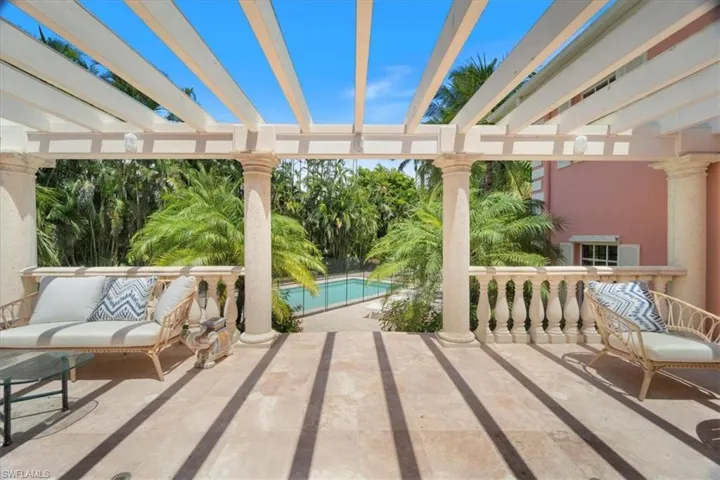 View of patio / terrace featuring an outdoor pool and a pergola