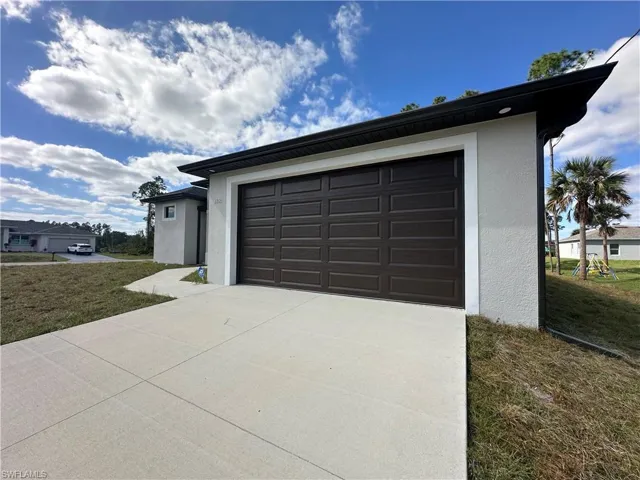 Garage with a lawn