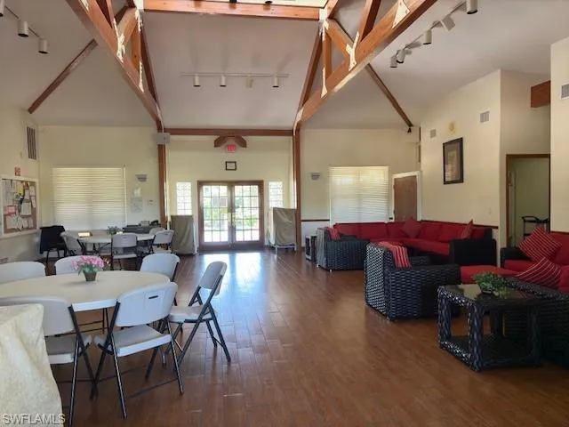 Clubhouse with several tables and chairs and sofas