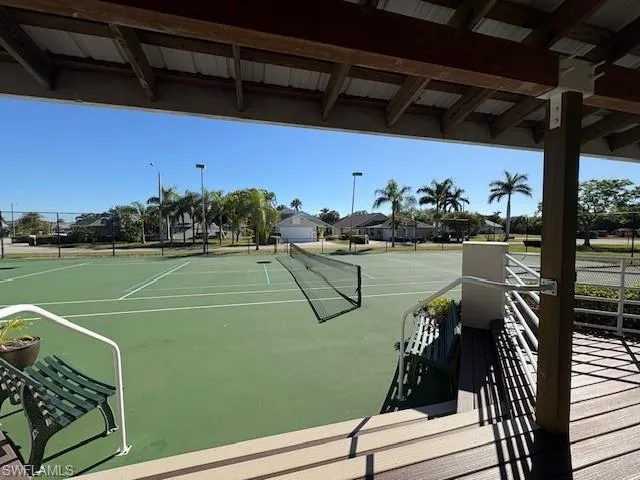 View of tennis court from doorway of the exercise room